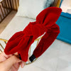 Red knotted headband for woman