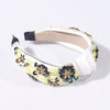 white floral headband desinger